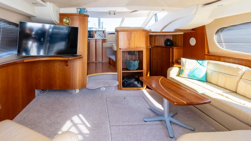  Yacht Photos Pics 2002 Silverton 41 Sport Bridge interior with modern furnishings and entertainment setup.