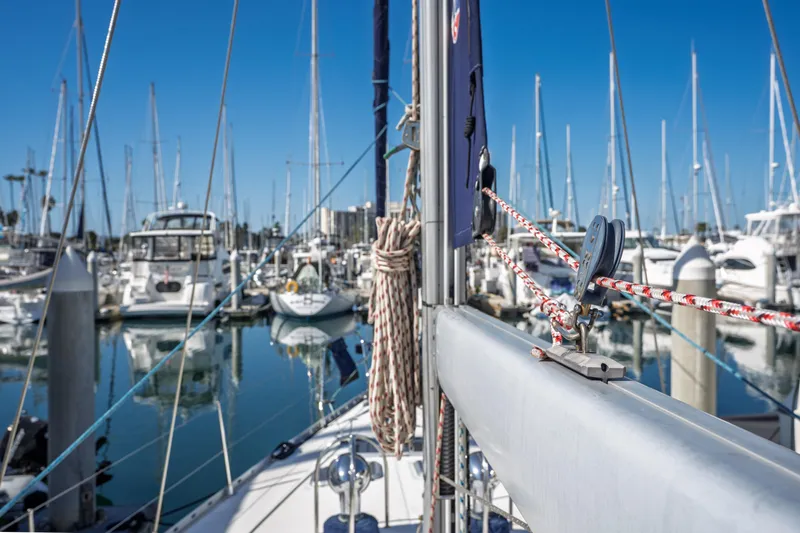 "champagne" Yacht Photos Pics Jeanneau Sun Odyssey 45.2 sailboat in marina, showcasing rigging and masts, 2003 model.