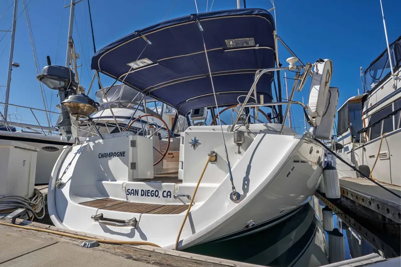 "champagne" Yacht Photos Pics 2003 Jeanneau Sun Odyssey 45.2 sailboat docked in San Diego marina.