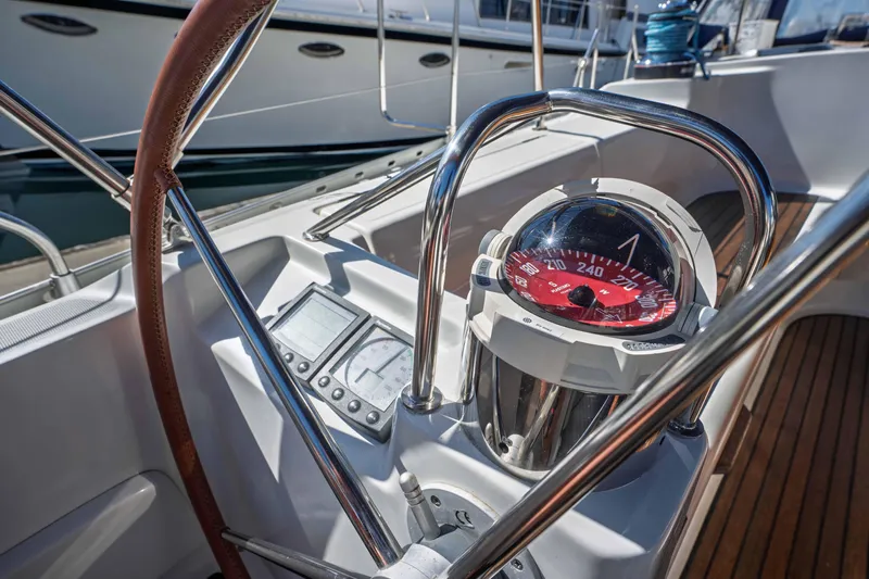 "champagne" Yacht Photos Pics Cockpit of 2003 Jeanneau Sun Odyssey 45.2 sailboat with compass and navigation instruments.