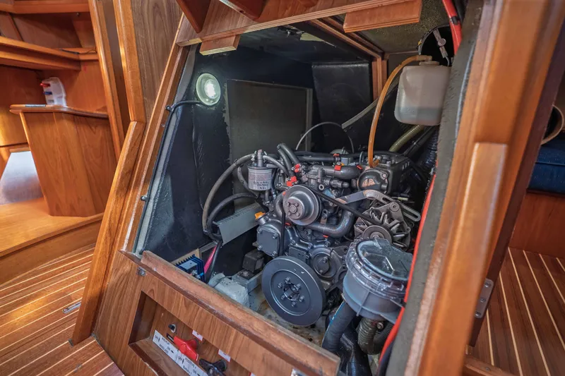 "champagne" Yacht Photos Pics Engine compartment of 2003 Jeanneau Sun Odyssey 45.2 sailboat, showcasing detailed mechanics.