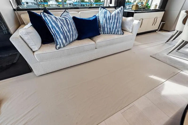 Deep Blue Yacht Photos Pics Luxurious interior of 2018 Azimut Flybridge yacht with elegant sofa and decorative pillows.