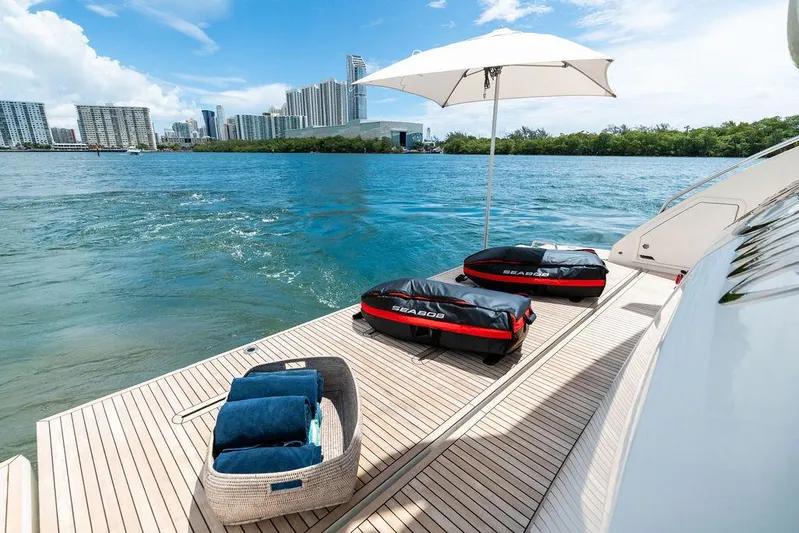 Deep Blue Yacht Photos Pics Luxurious 2018 Azimut Flybridge yacht deck with city skyline and water view.