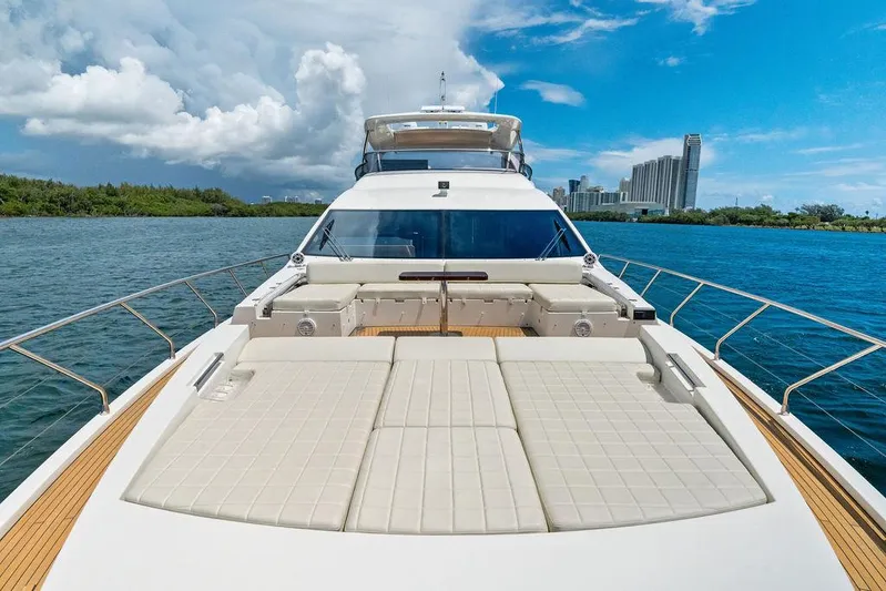 Deep Blue Yacht Photos Pics 2018 Azimut Flybridge yacht on water with city skyline in background.