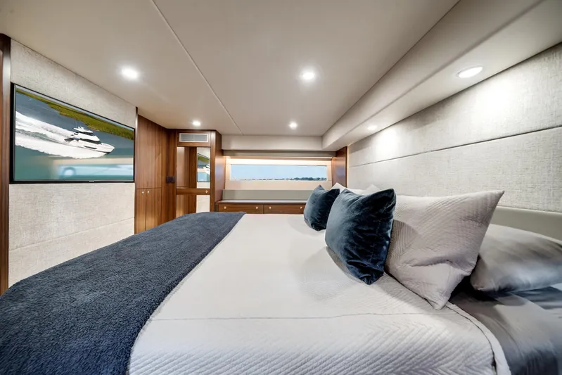 Godspeed Yacht Photos Pics Luxurious 2024 Maritimo M55 yacht bedroom with elegant decor and modern amenities.
