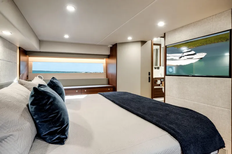 Godspeed Yacht Photos Pics Luxurious bedroom interior of 2024 Maritimo M55 yacht with modern decor and large window view.