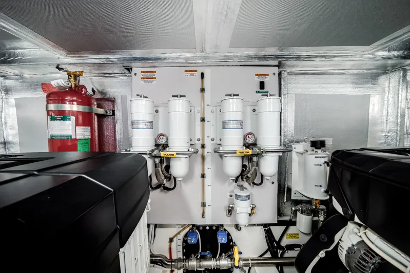 Godspeed Yacht Photos Pics Engine room of 2024 Maritimo M55 yacht with fire extinguisher and filtration system.