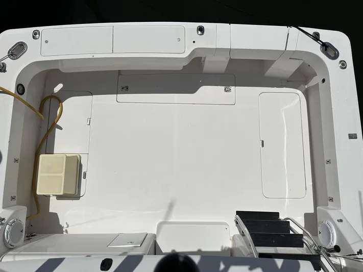  Yacht Photos Pics 2003 Luhrs 40 Convertible boat deck, featuring spacious layout and storage compartments.