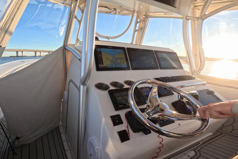  Yacht Photos Pics Helm of 2007 Cape Horn 36T boat with navigation screens and steering wheel.