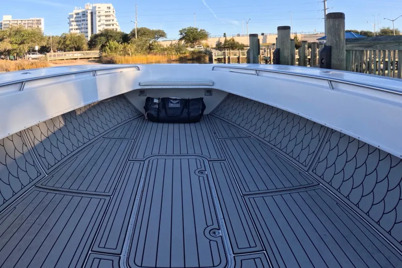  Yacht Photos Pics 2007 Cape Horn 36T boat interior with patterned flooring, docked near urban buildings.