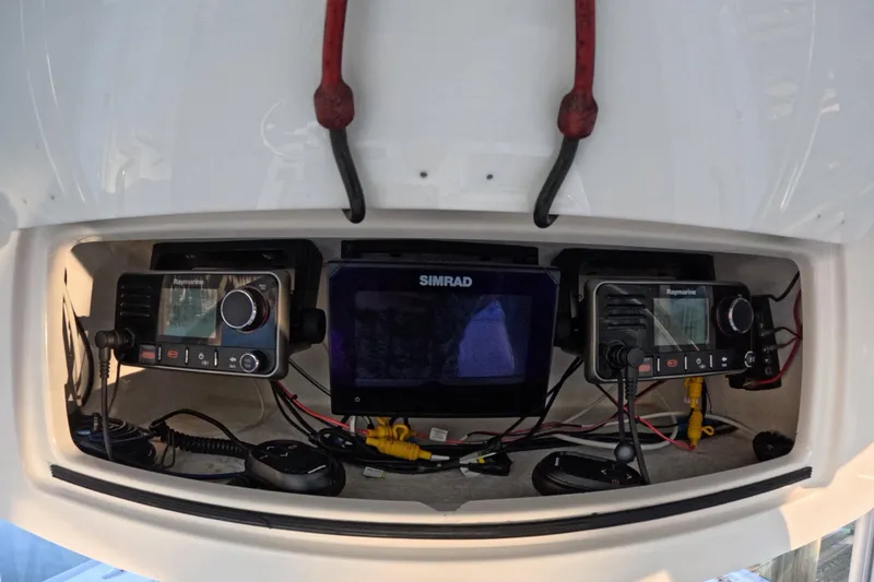  Yacht Photos Pics Electronics panel on a 2007 Cape Horn 36T boat with Raymarine and Simrad devices.