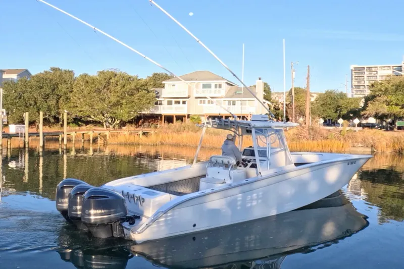  Yacht Photos Pics 2007 Cape Horn 36T boat with dual Yamaha engines on calm water near docks.
