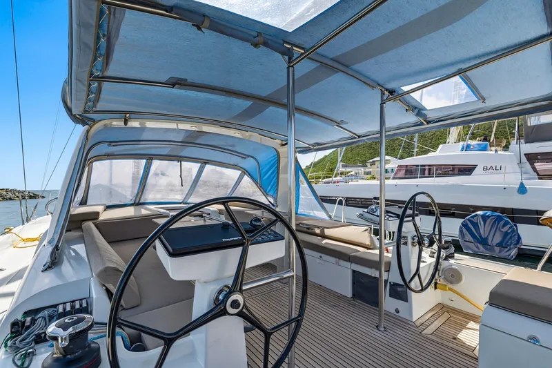 Heartbeat Yacht Photos Pics 2024 Beneteau Oceanis Yacht 54 cockpit with dual steering wheels and canopy.