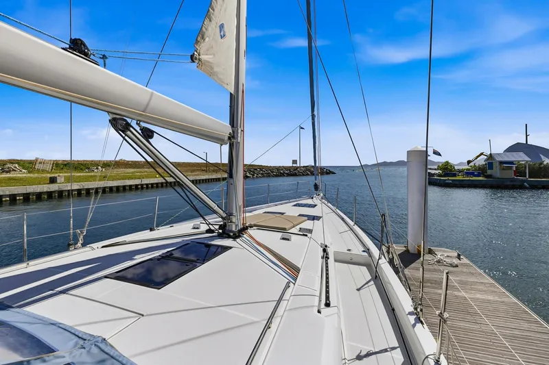 Heartbeat Yacht Photos Pics 2024 Beneteau Oceanis Yacht 54 docked, showcasing sleek design and spacious deck.