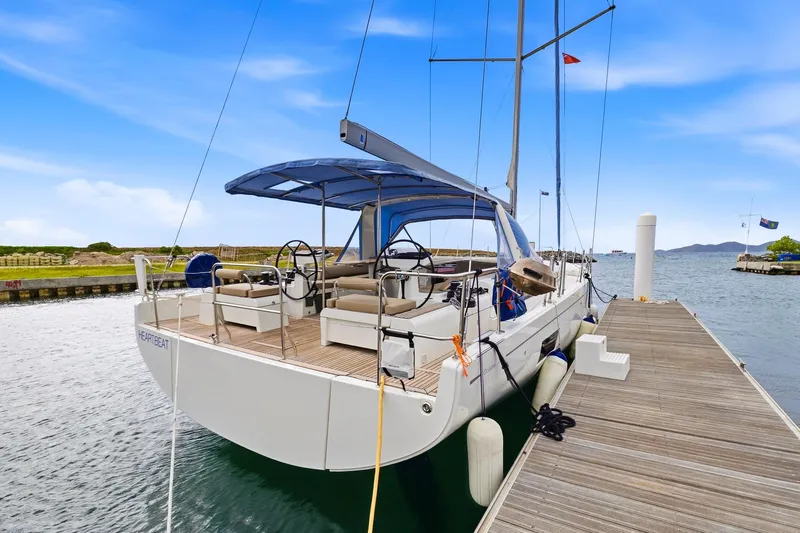 Heartbeat Yacht Photos Pics 2024 Beneteau Oceanis Yacht 54 docked, showcasing sleek design and spacious deck.