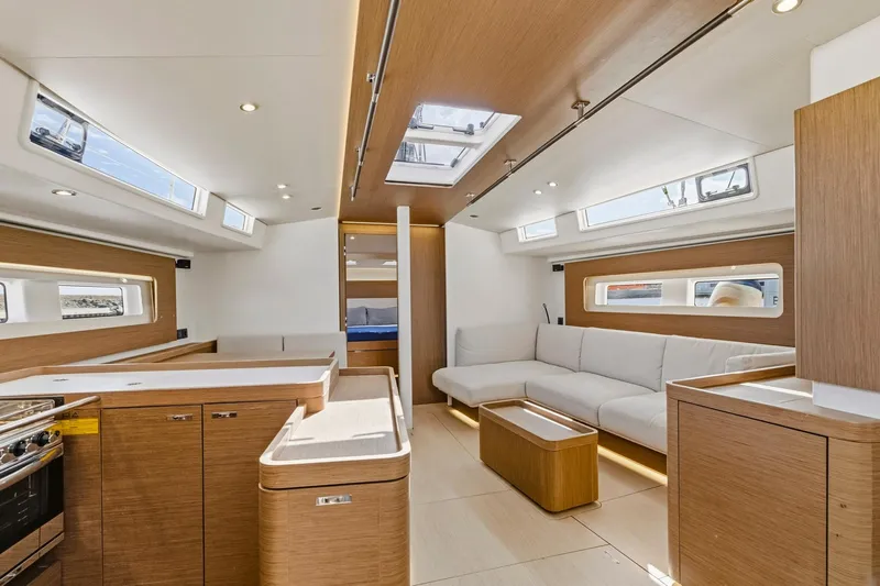 Heartbeat Yacht Photos Pics Luxurious interior of 2024 Beneteau Oceanis Yacht 54 with modern design and spacious seating.