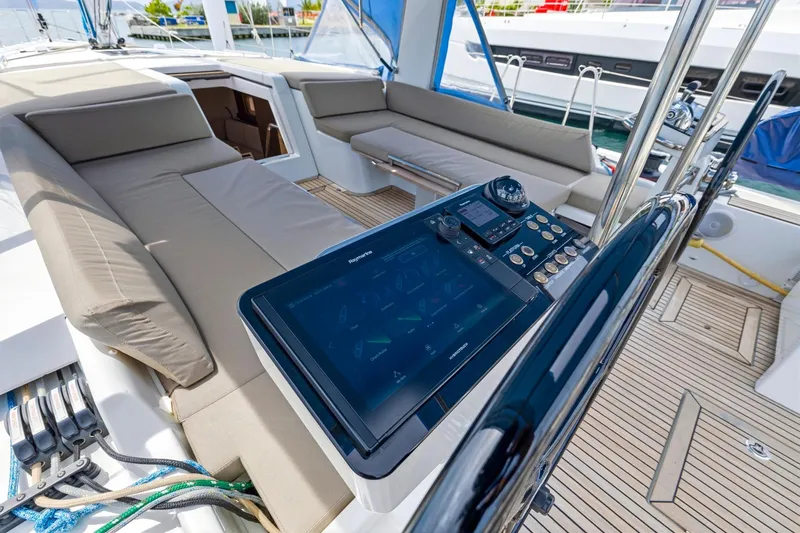 Heartbeat Yacht Photos Pics Luxurious cockpit of 2024 Beneteau Oceanis Yacht 54 with modern navigation controls.