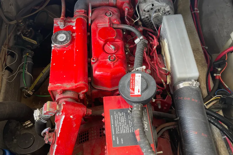  Yacht Photos Pics Engine compartment of a 1988 Chris-Craft 392 Sport Fish boat, featuring red components.