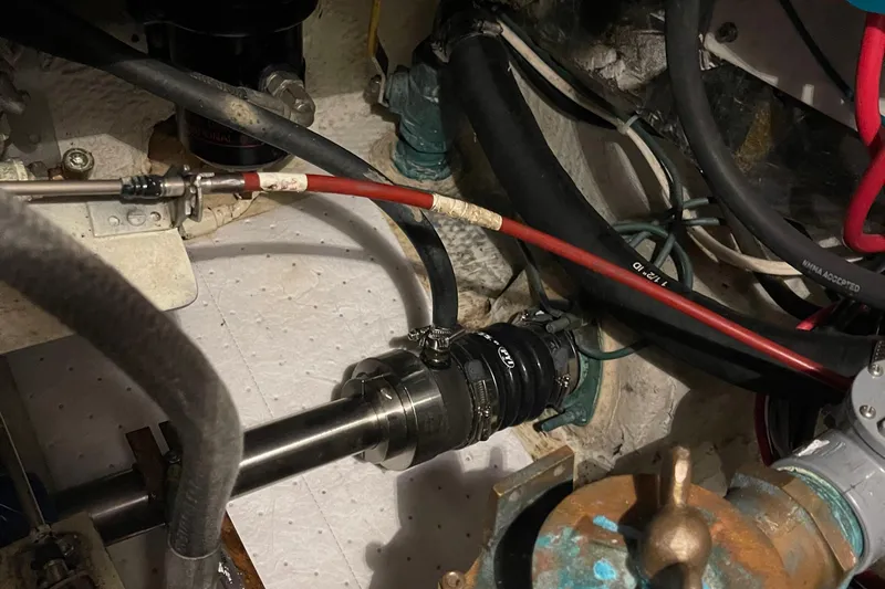  Yacht Photos Pics Engine compartment of 1988 Chris-Craft 392 Sport Fish with visible hoses and fittings.