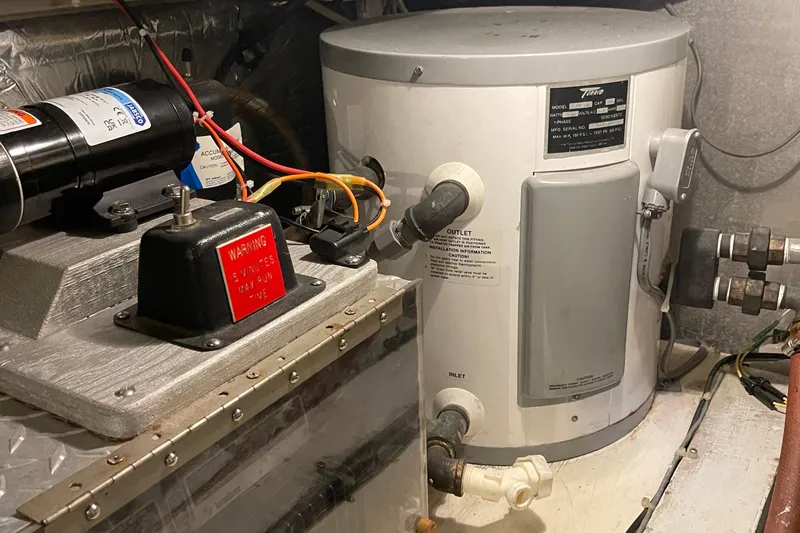  Yacht Photos Pics Engine room of 1988 Chris-Craft 392 Sport Fish with water heater and wiring.