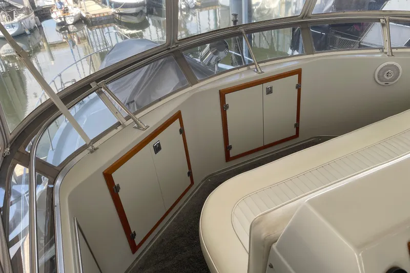  Yacht Photos Pics 1988 Chris-Craft 392 Sport Fish boat interior with seating and storage compartments.