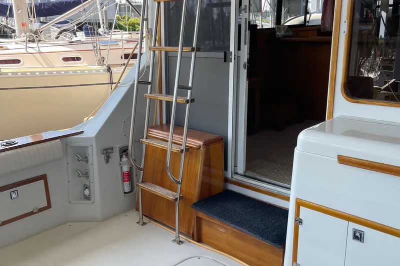  Yacht Photos Pics 1988 Chris-Craft 392 Sport Fish boat interior with ladder and cabin entrance.