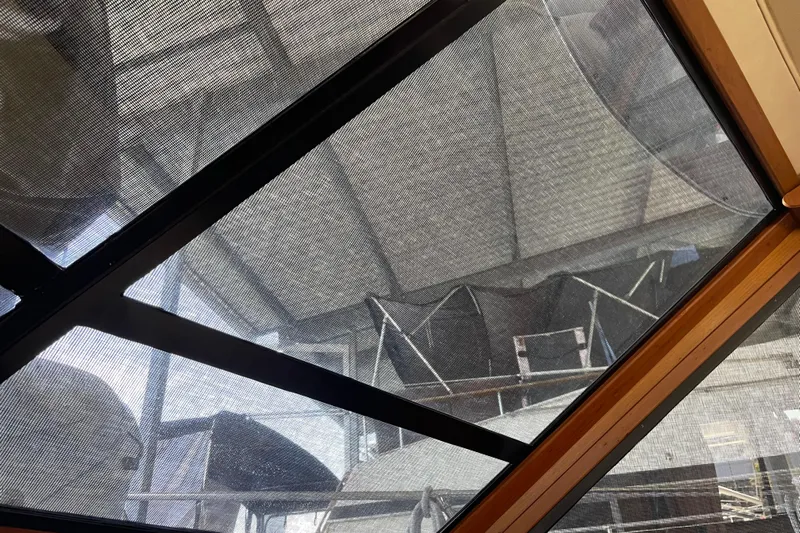  Yacht Photos Pics 1988 Chris-Craft 392 Sport Fish boat under protective cover in storage facility.