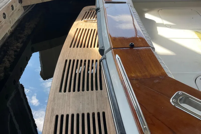  Yacht Photos Pics 1988 Chris-Craft 392 Sport Fish boat with wooden deck and polished metal details.