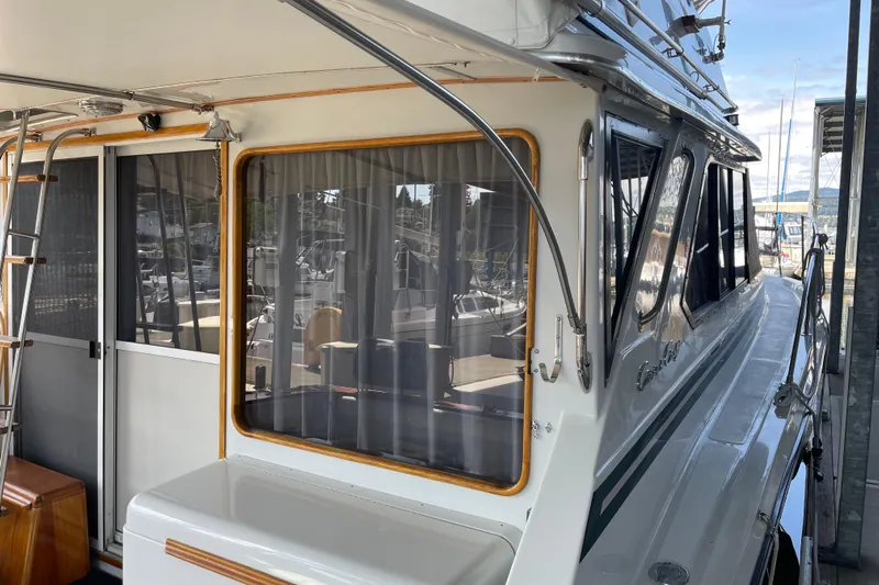  Yacht Photos Pics 1988 Chris-Craft 392 Sport Fish boat docked, featuring sleek design and spacious cabin.