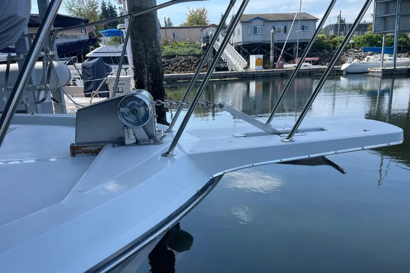  Yacht Photos Pics 1988 Chris-Craft 392 Sport Fish boat docked at a marina, featuring a sleek bow design.