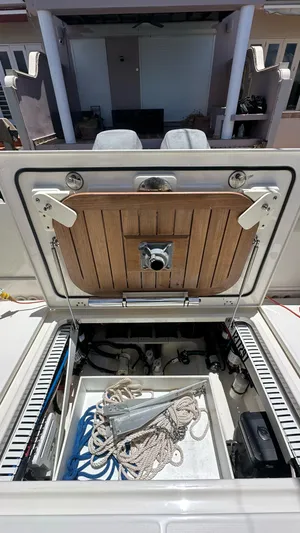  Yacht Photos Pics 2017 Boston Whaler 330 Outrage storage compartment with ropes and anchor.