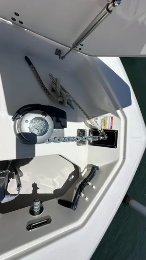  Yacht Photos Pics 2017 Boston Whaler 330 Outrage anchor compartment with chain and winch.