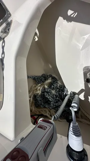  Yacht Photos Pics 2017 Boston Whaler 330 Outrage boat interior with anchor chain and marine equipment.