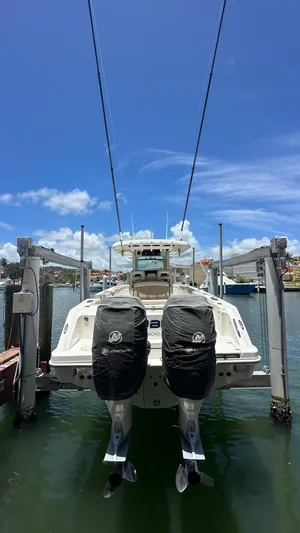  Yacht Photos Pics 2017 Boston Whaler 330 Outrage boat with dual engines on a lift.