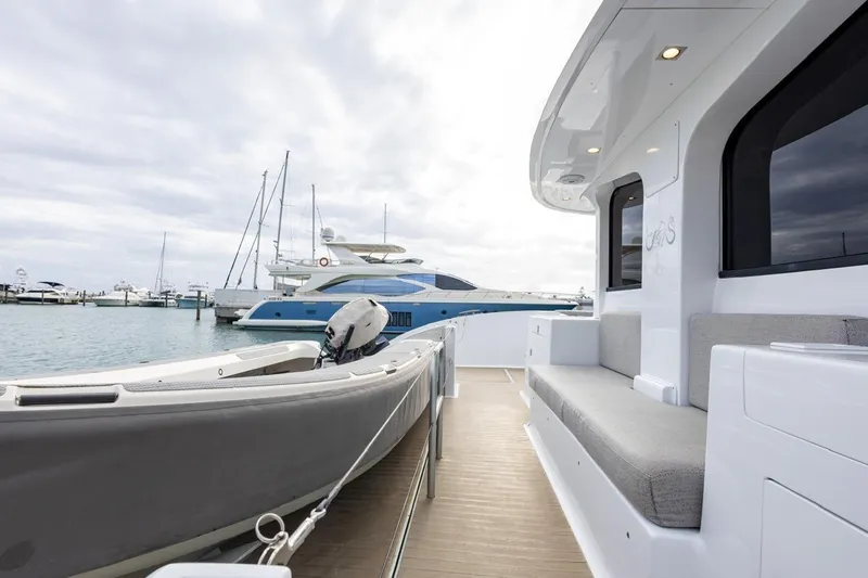 Katari Yacht Photos Pics Luxury yacht Tag 60, 2018 model, docked at marina with sleek design and spacious deck.