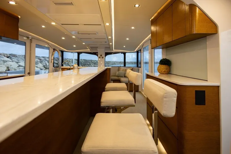 Katari Yacht Photos Pics Luxurious interior of 2018 Tag 60 yacht with modern seating and elegant design.