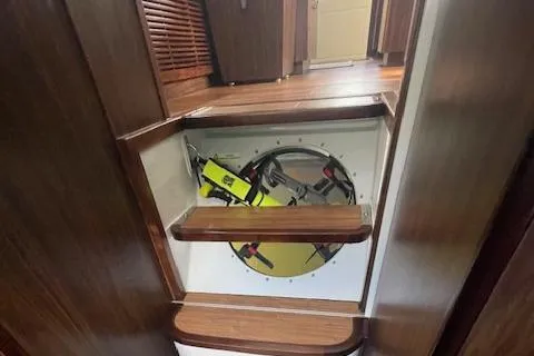 Honey Ryder Yacht Photos Pics Interior of 2022 HH Catamarans 50, showing wooden steps and storage compartment.