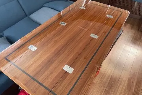 Honey Ryder Yacht Photos Pics Luxurious wooden table in 2022 HH Catamarans 50 interior, featuring elegant design and craftsmanship.