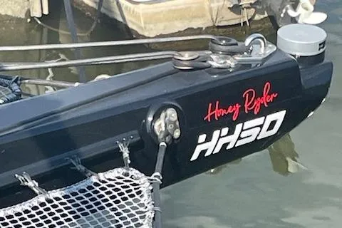 Honey Ryder Yacht Photos Pics HH Catamarans 50, 2022 model, with "Honey Ryder" branding at a marina.