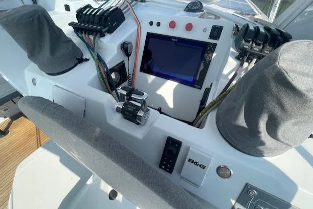 Honey Ryder Yacht Photos Pics Control panel of 2022 HH Catamarans 50 with navigation screen and covered instruments.