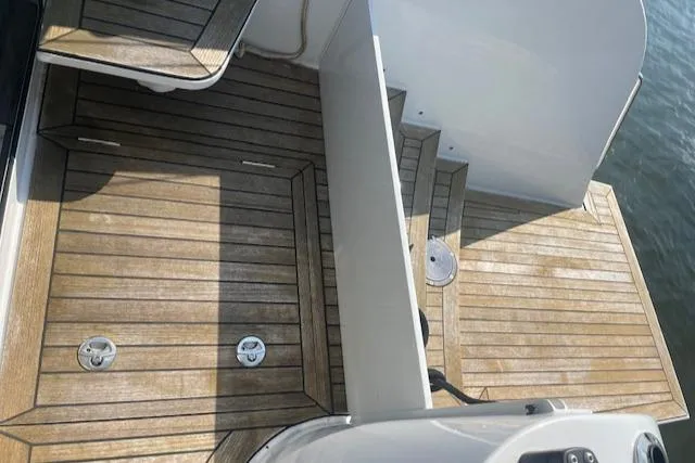 Honey Ryder Yacht Photos Pics Teak deck of 2022 HH Catamarans 50, showcasing elegant wood finish.