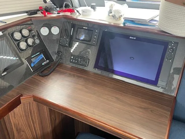 Honey Ryder Yacht Photos Pics Control panel of 2022 HH Catamarans 50 with navigation and communication equipment.