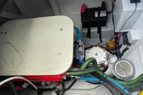 Honey Ryder Yacht Photos Pics Engine compartment of 2022 HH Catamarans 50, featuring wiring and mechanical components.