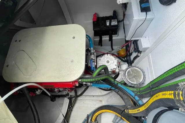 Honey Ryder Yacht Photos Pics Engine compartment of 2022 HH Catamarans 50, showcasing wiring and mechanical components.