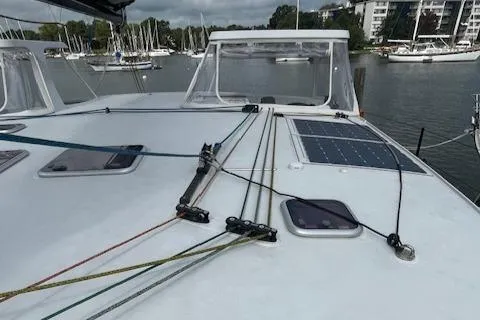 Honey Ryder Yacht Photos Pics 2022 HH Catamarans 50 deck with ropes and solar panel in marina setting.