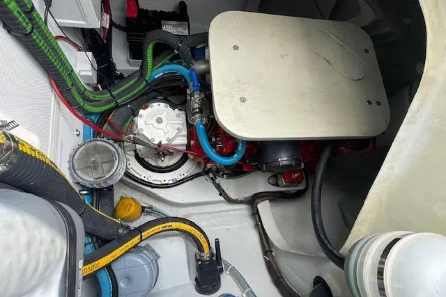 Honey Ryder Yacht Photos Pics Engine compartment of a 2022 HH Catamarans 50, showcasing various hoses and components.