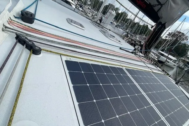 Honey Ryder Yacht Photos Pics 2022 HH Catamarans 50 with solar panels on deck, docked at marina.