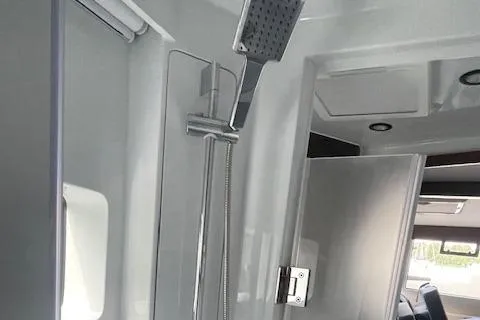 Honey Ryder Yacht Photos Pics Modern shower area inside 2022 HH Catamarans 50, featuring sleek design and fixtures.