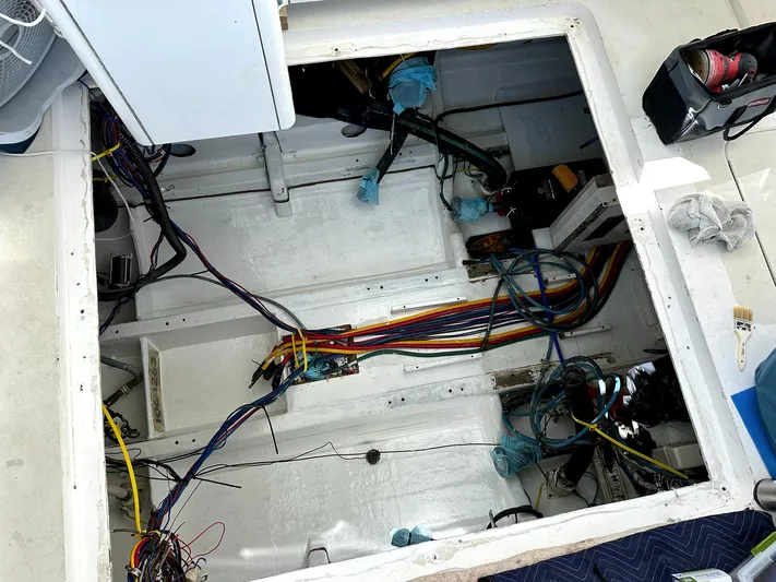  Yacht Photos Pics Engine compartment of 1998 Hatteras 39 Sport Express with exposed wiring and components.