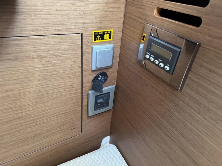  Yacht Photos Pics Control panel inside 2020 Jeanneau Leader 9.0 WA boat, featuring switches and a digital display.